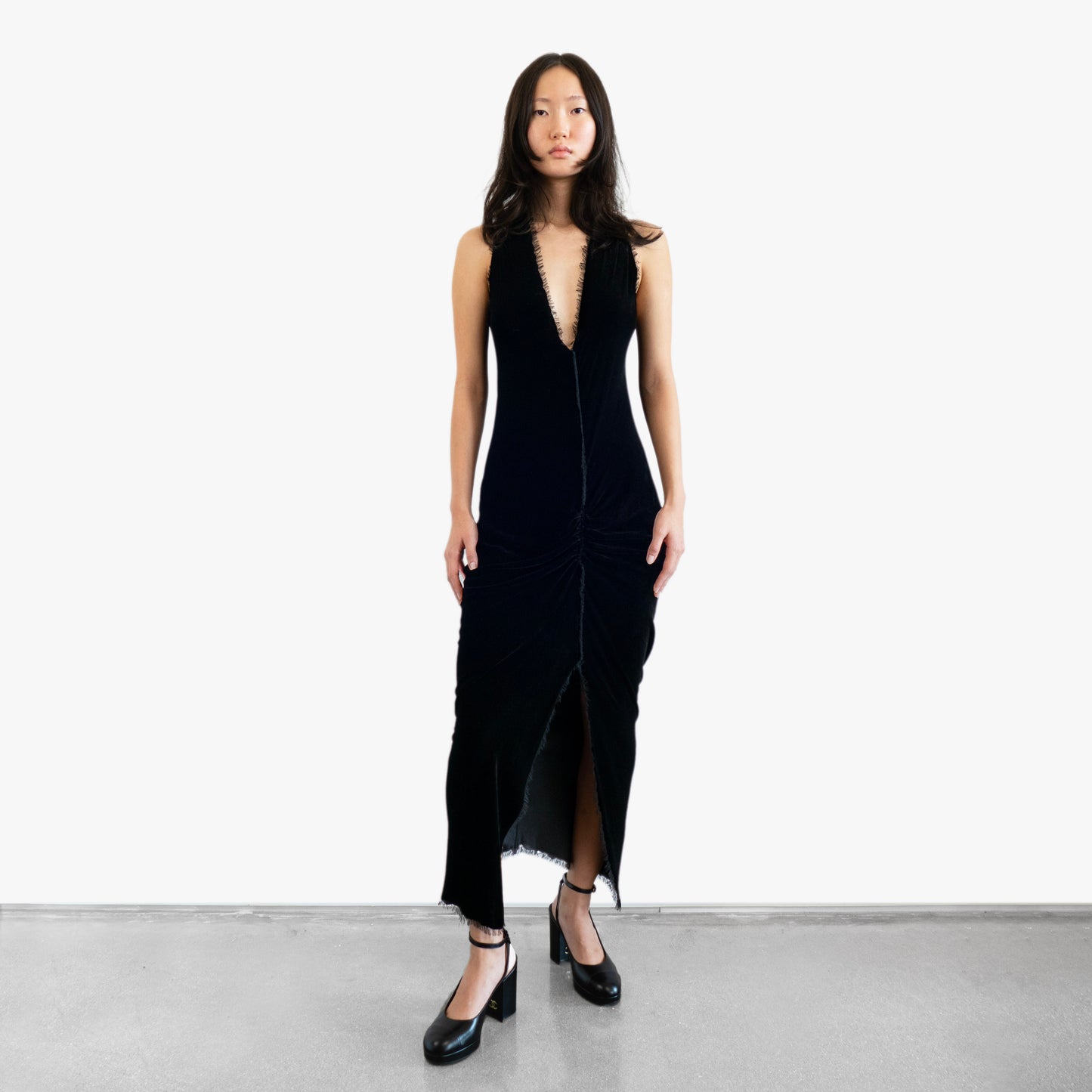 Model wearing a black velvet dress