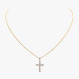 14K gold cross necklace set with diamonds by AM Studio on a 14K gold chain.