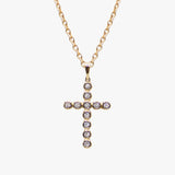 14K gold cross necklace set with diamonds by AM Studio on a 14K gold chain.