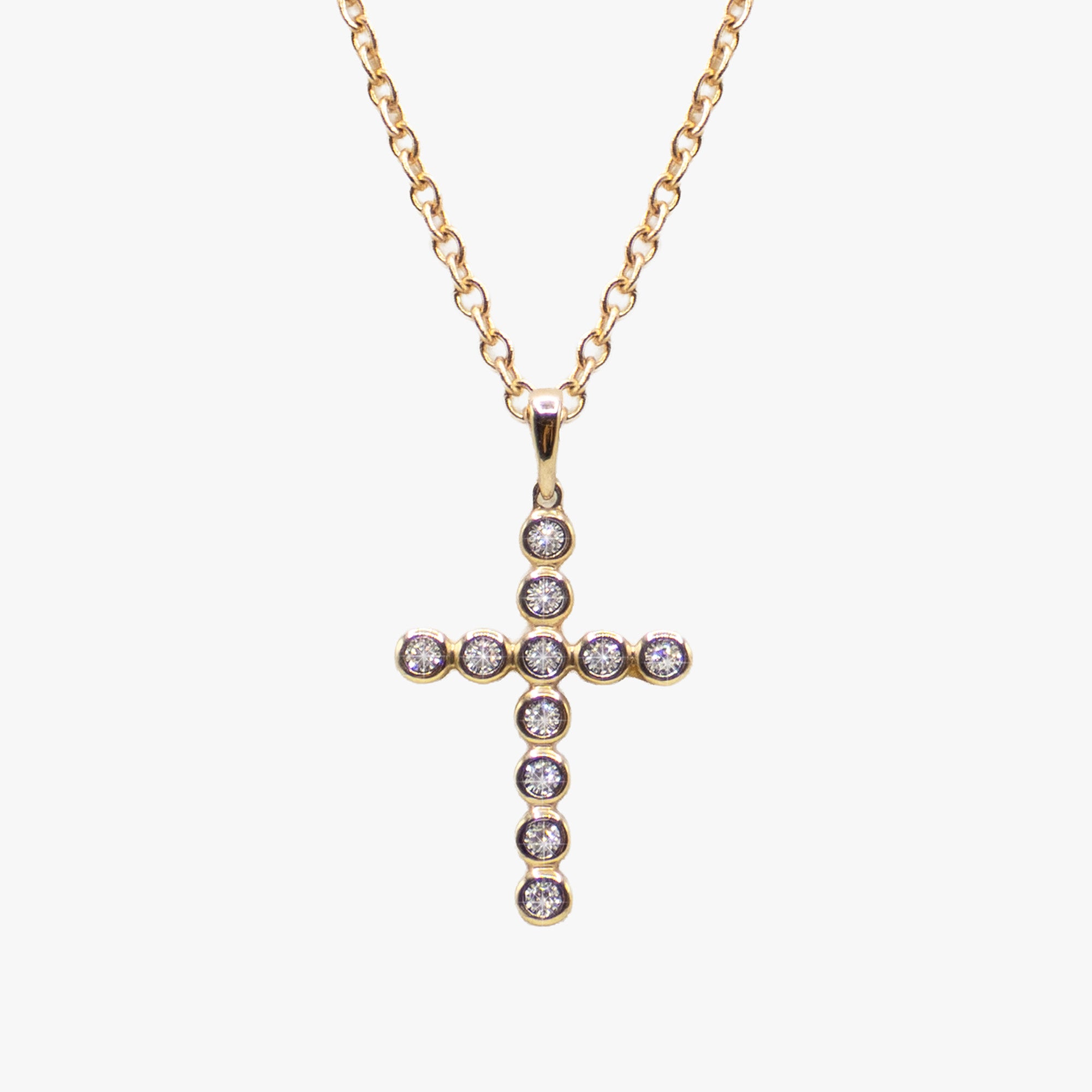 14K gold cross necklace set with diamonds by AM Studio on a 14K gold chain.