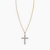 14K gold cross necklace set with diamonds by AM Studio on a 14K gold chain.