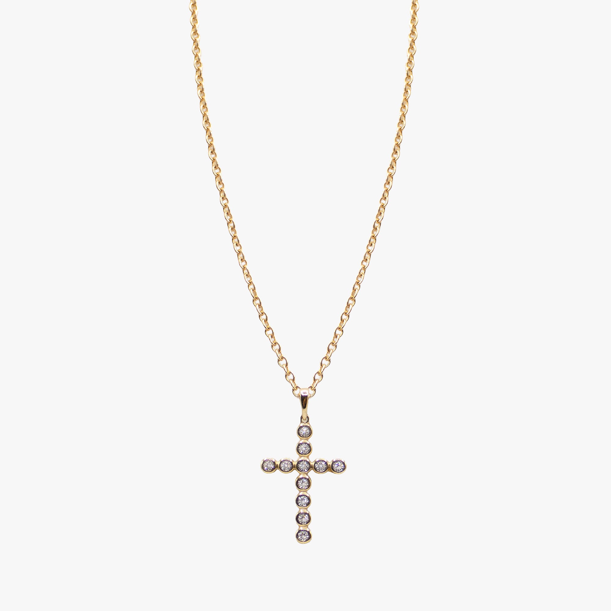 14K gold cross necklace set with diamonds by AM Studio on a 14K gold chain.