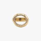 A gold ring with a circular openwork design, featuring a row of small clear stones along the top inner edge.
