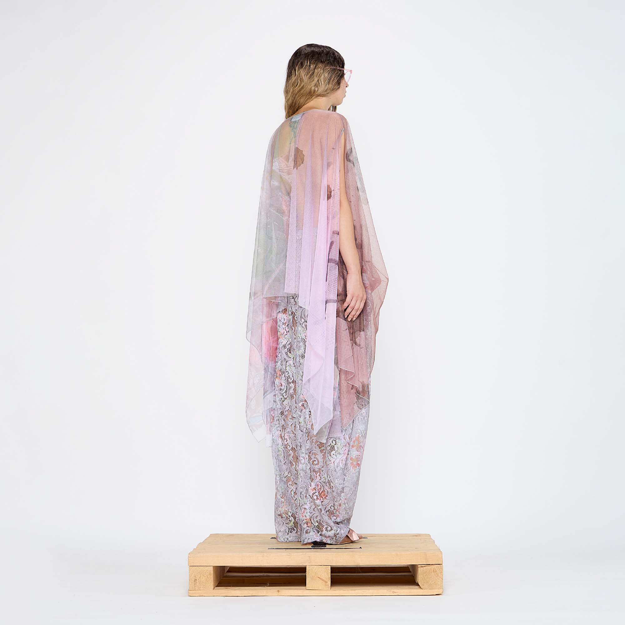  Barbara Bologna Sheer Print Top, back fullody view — sheer watercolor print cape-top in blush pink, rose, and lavender with bateau neckline and dramatic draped panels