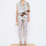 Barbara Bologna Mixed Print Textured Stolla Vest, front view — sleeveless cotton vest with a ollage print featuring crocodile, plaid, and floral patterns, belted at waist