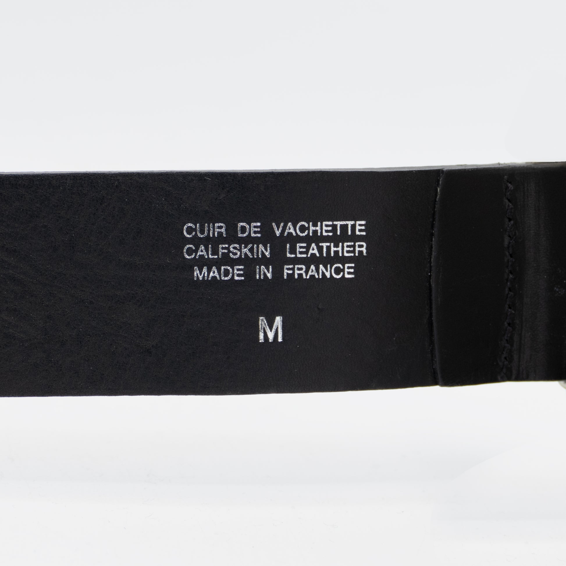 Belt details stamped on leather strap