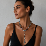 A woman wearing a Tahitian pearl lariat necklace with detachable lariat