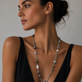 A woman wearing a Tahitian pearl and Baroque pearl necklace