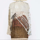 Barbara Bologna Print Shirt with Scarf, back view — large-scale earth tone figurative print wrapping across the back with contrasting plaid sleeves
