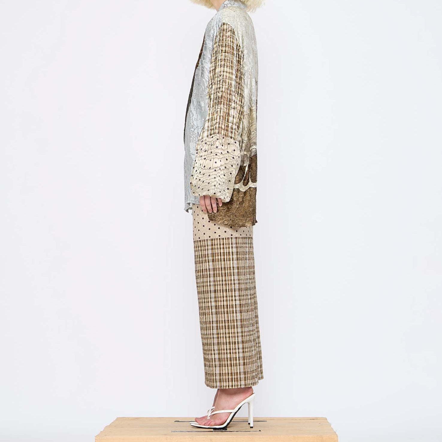 Barbara Bologna Print Shirt with Scarf, side full-body view — collage mixed-print viscose-silk shirt with figurative motif, plaid sleeves, and coordinating sheer scarf tied at collar, styled with a polka dot and plaid skirt