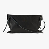 A black textured leather clutch bag with a thin dark strap and a small gold logo plate on the front, shown against a plain white background.