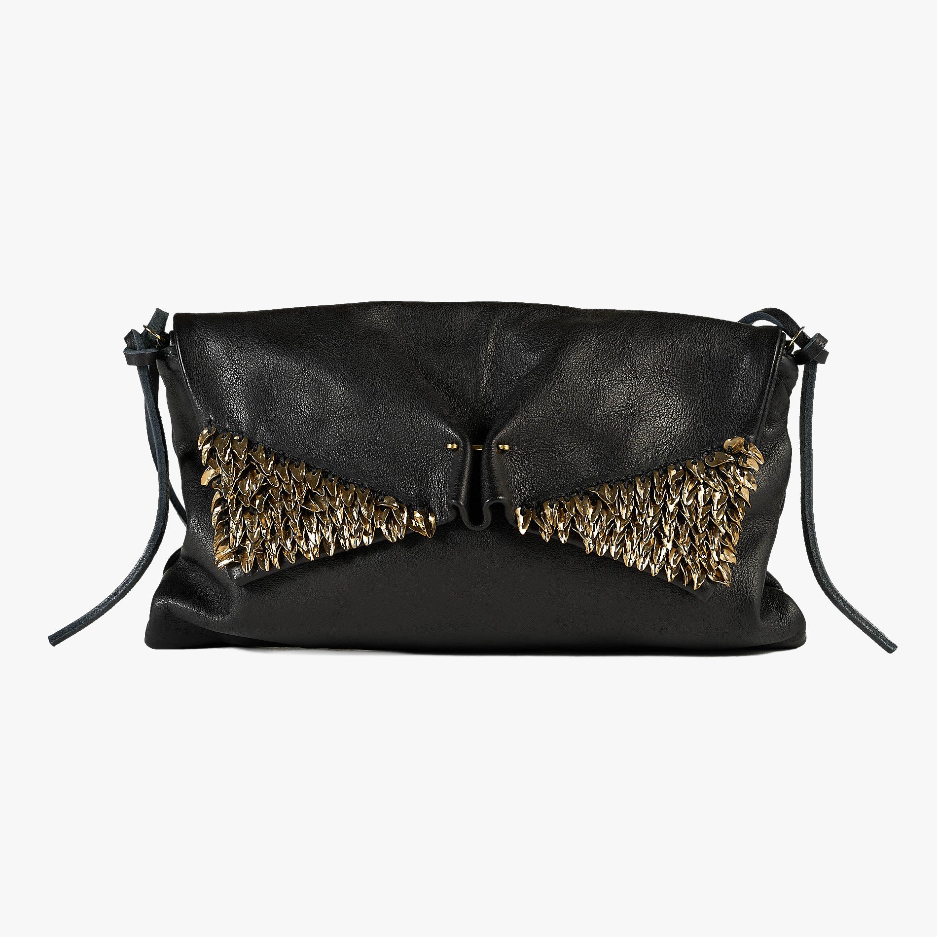 A black leather clutch bag with a unique wing-like flap adorned with gold metallic feathers, set against a plain light gray background.