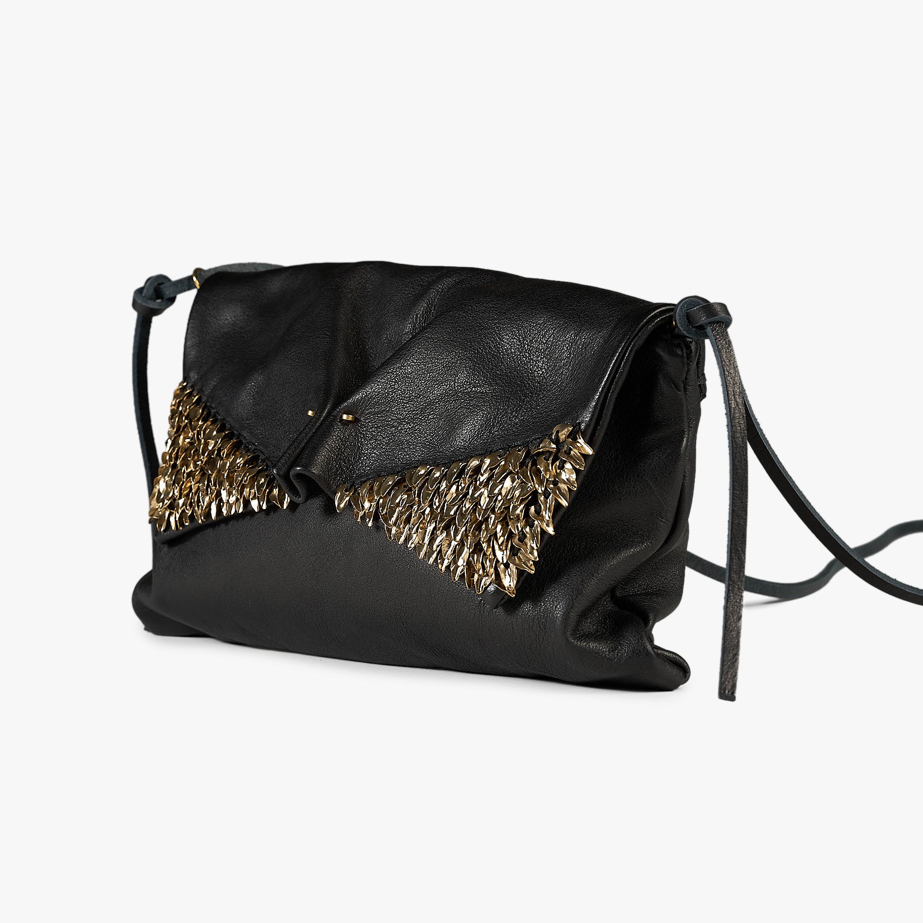 Black leather clutch bag with a gold feather-like embellishment on the front flap and a thin black shoulder strap, shown on a light gray background.