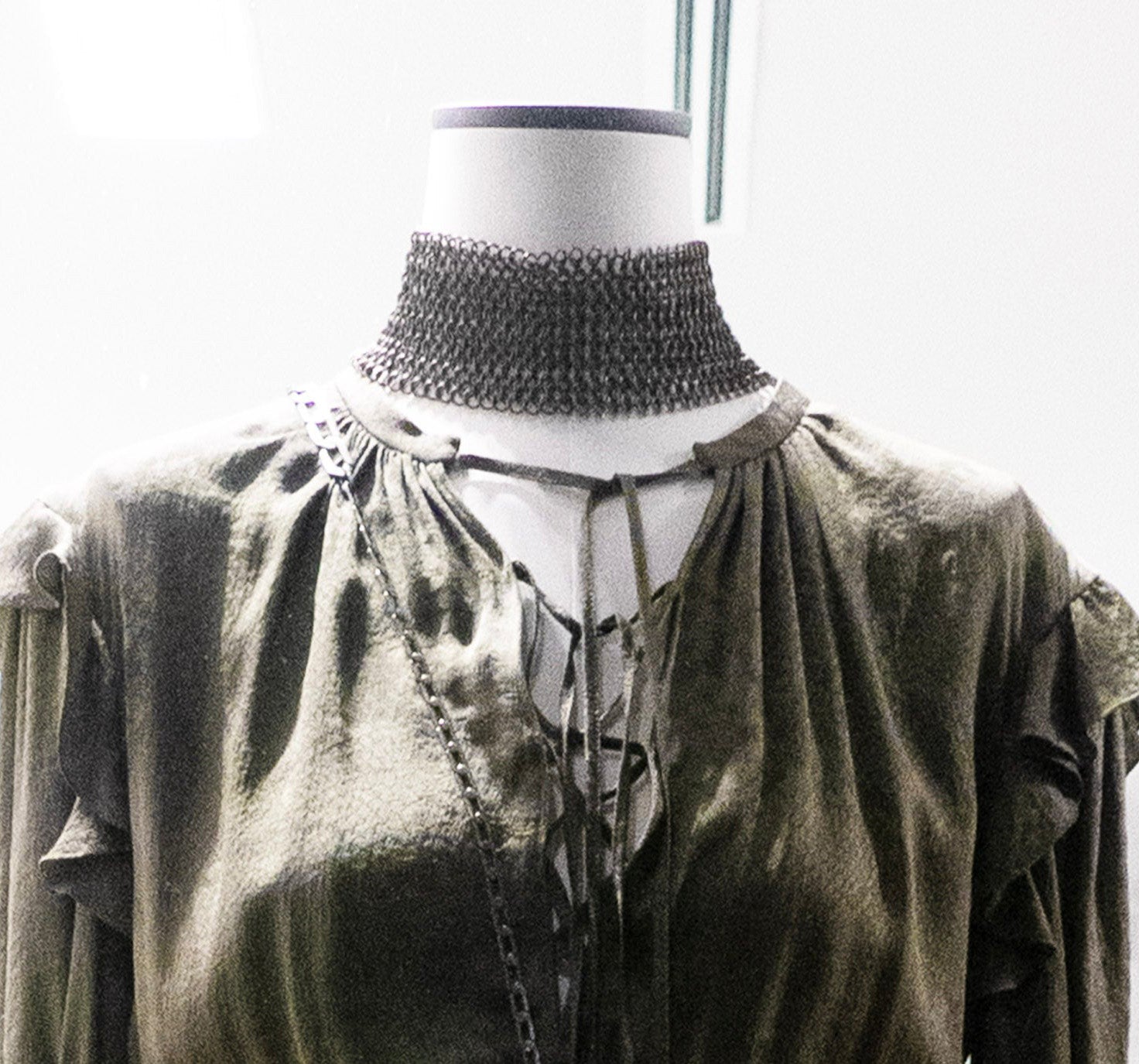 Laura B Jeanne Bronze Choker styled on mannequin over olive velvet top with long tie detail