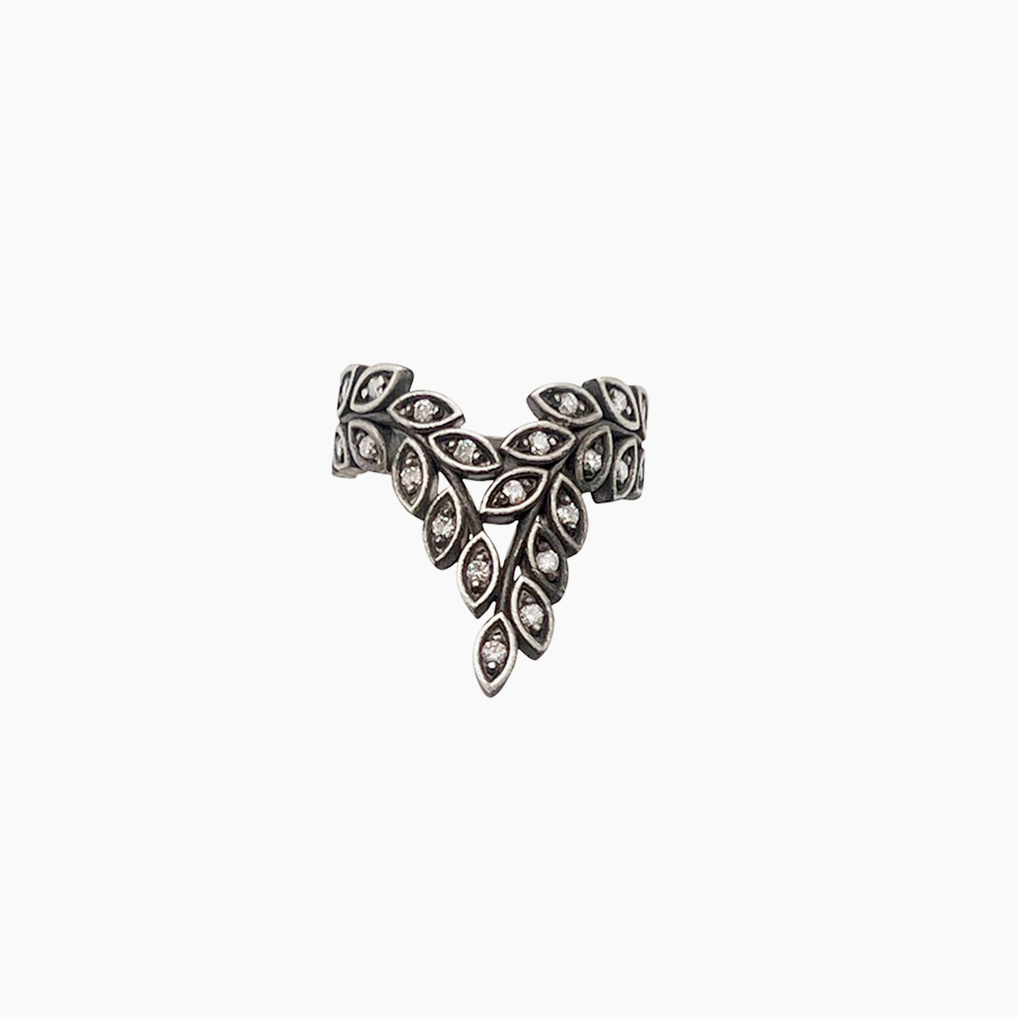 A silver-toned leaf-shaped ring with diamonds set in each leaf, shown against a plain white background.