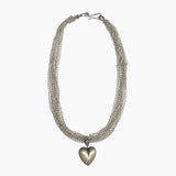 A silver-toned multi-strand chain necklace with a polished heart-shaped pendant, displayed against a clean white background.
