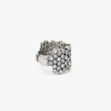 A wide silver cuff ring embellished with multiple rows of diamonds, photographed on a clean white background.