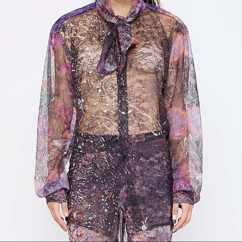 Barbara Bologna Sheer Print Open-Back Blouse — close-up front view, sheer abstract print blouse with neck tie and voluminous sleeves in purple and mauve tones, made in Italy