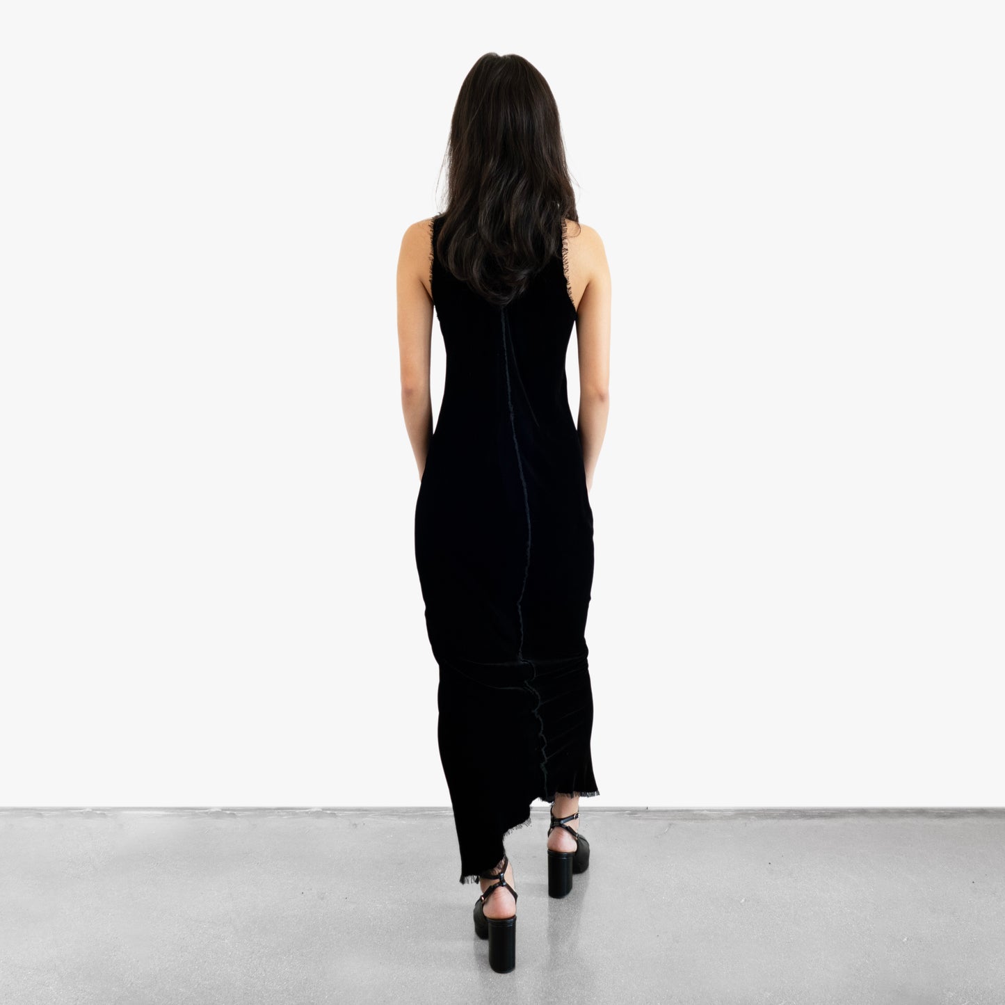 Model wearing a black velvet dress