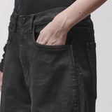 A woman's hand in the pocket  black jeans