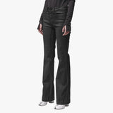 A woman wearing black flared jeans