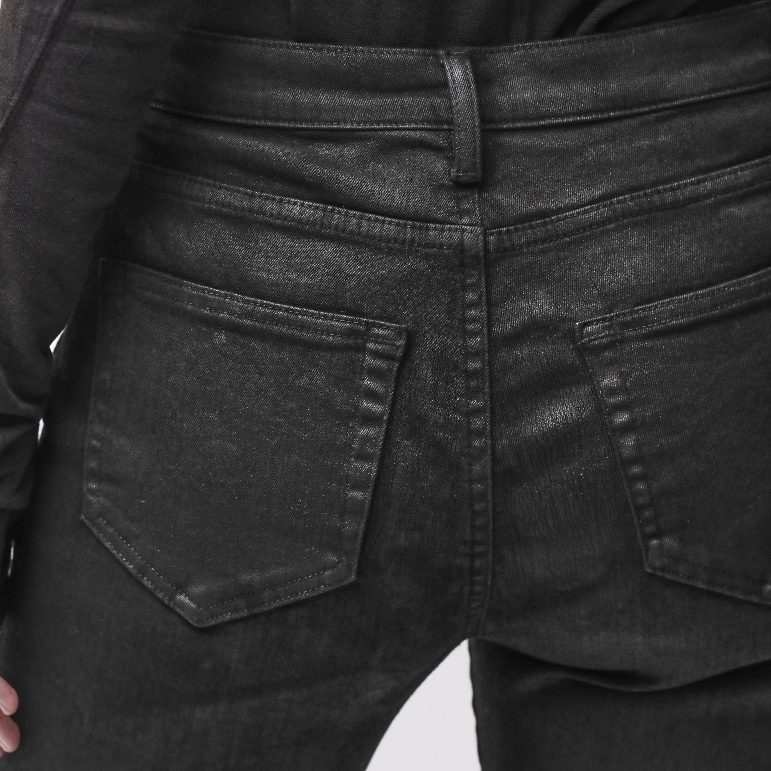 Back pocket detail of black jeans