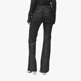 Back view of a woman wearing black flared jeans