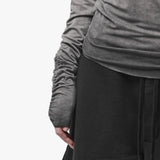 Sleeve detail of a grey top