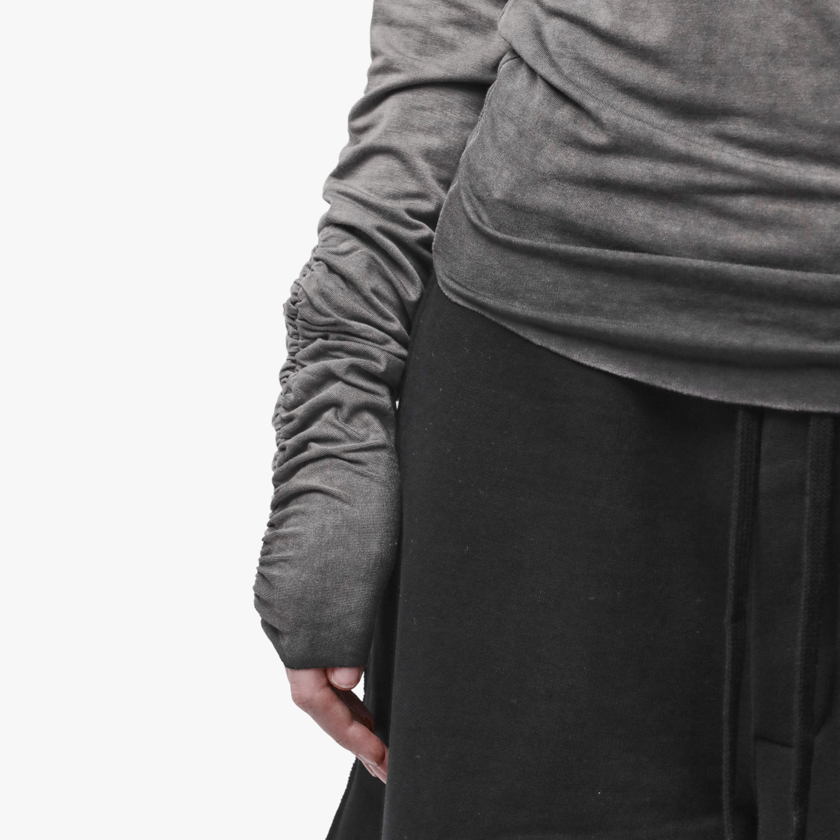 Sleeve detail of a grey top