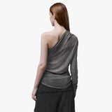 Back view of a woman wearing an asymmetrical grey top 