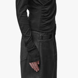 Sleeve detail of a black top