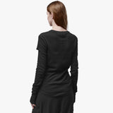 Back of a woman wearing a crew neck t-shirt