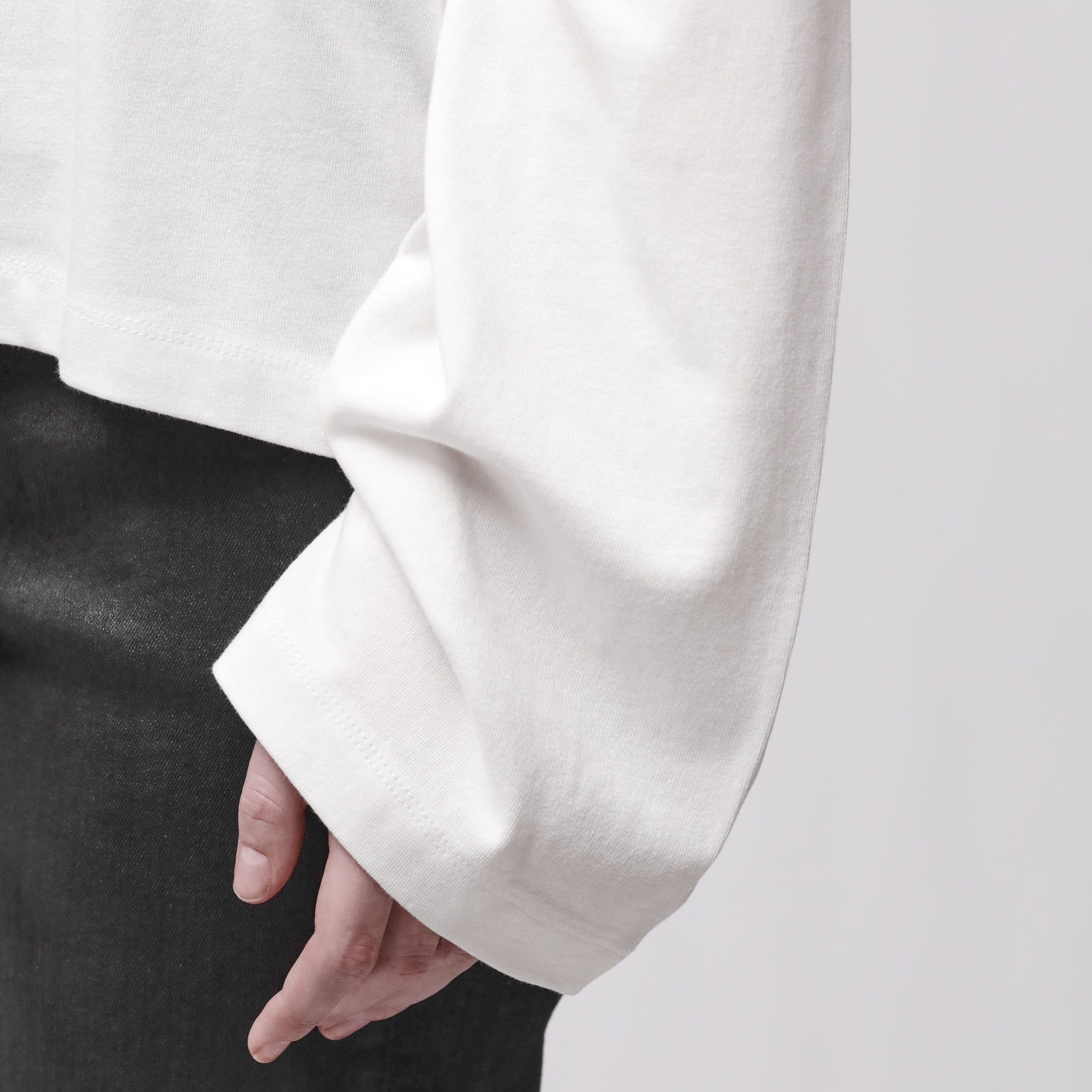 Sleeve detail of a long sleeve white t-shirt