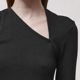 Detail of a black t-shirt with an asymmetric neckline 